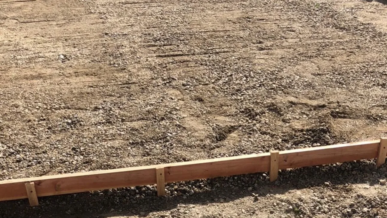 Compacted base inside timber forms ready for a large concrete pour